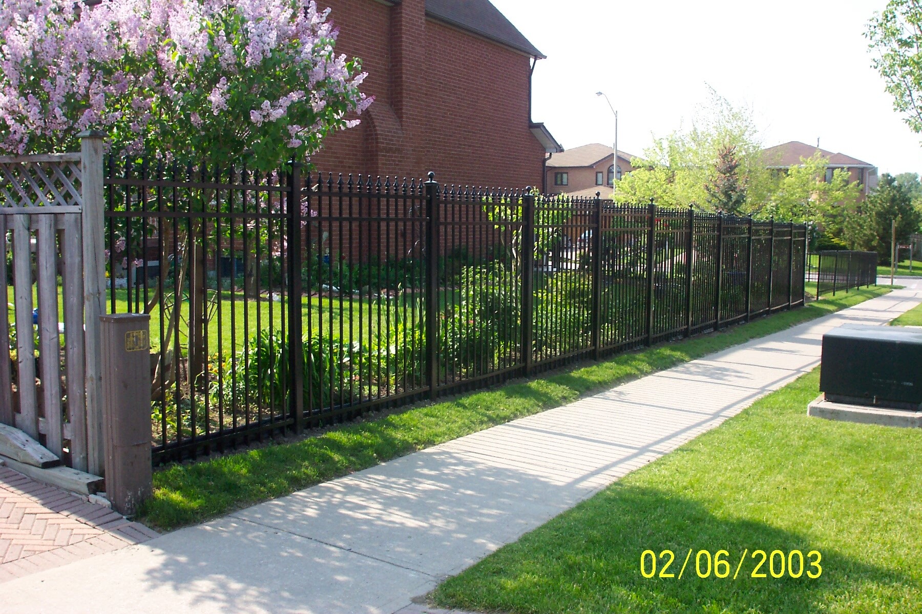 Prefab aluminum fence panels installed on a modern property